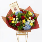 "Birthday Bloom" 9 Red Roses ,seasonal flowers and Birthday Card